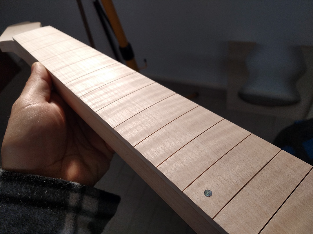 Build your own guitar online radiusing the fretboard